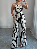 Women's Abstract Print Halter Neck Jumpsuit With Open Back Sleeveless Belted Wide-Leg For Evening Wear